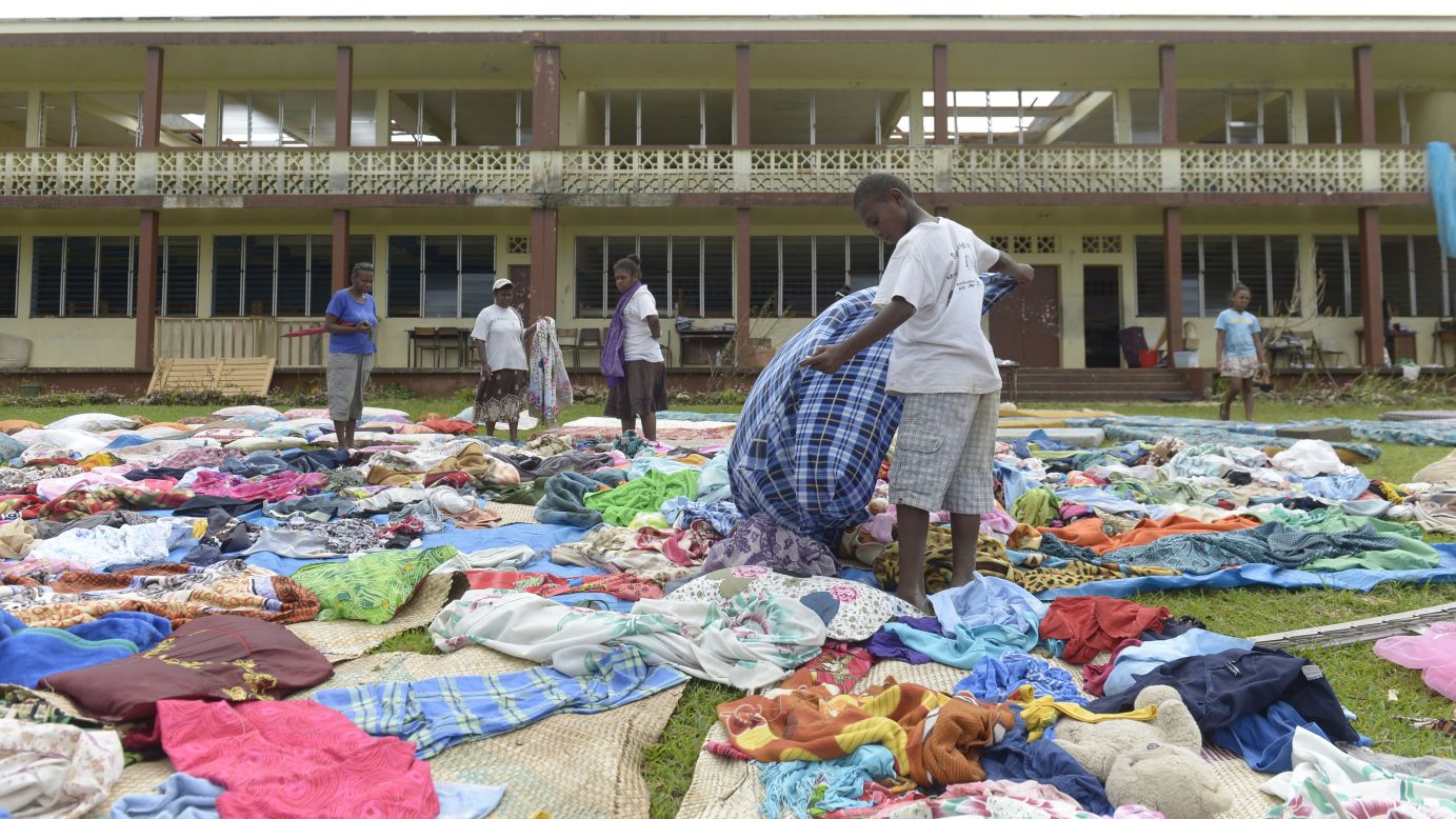 People put clothes out to dry near Port Vila on March 19.