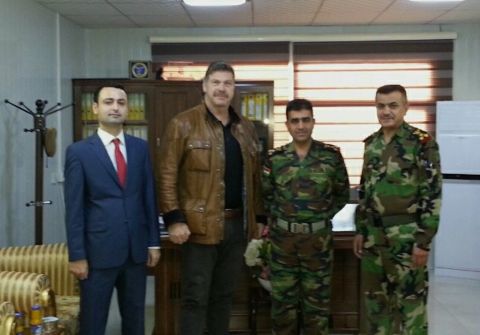 Tony Sinnott and Yakhi Balak from the 1st North American Expeditionary Force attend a liaison meeting with Peshmerga Brigadier General Hajar Osman Ismael and his deputy.