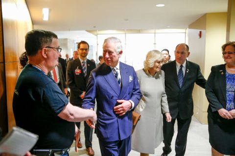 The royal couple greet residents and staff as they tour the Armed Forces Retirement Home on March 19.