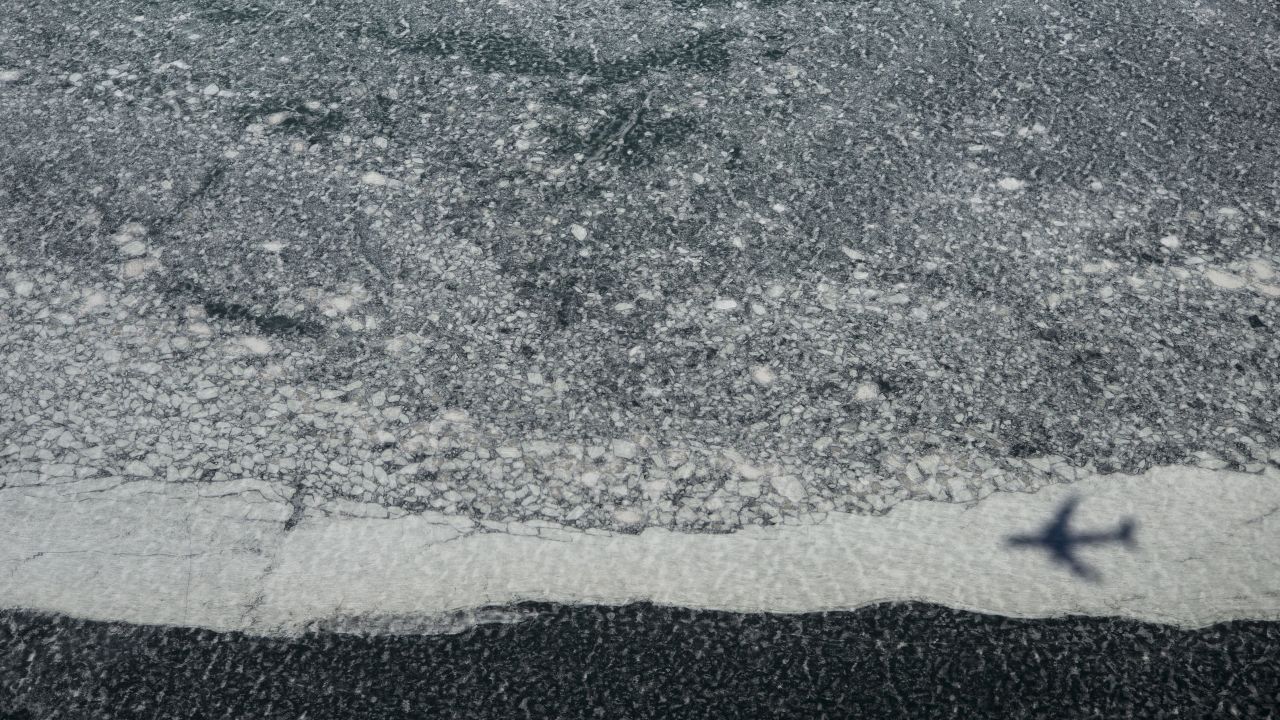 The shadow of Air Force One is seen on a frozen Lake Erie as U.S. President Barack Obama flies to Cleveland on Wednesday, March 18.
