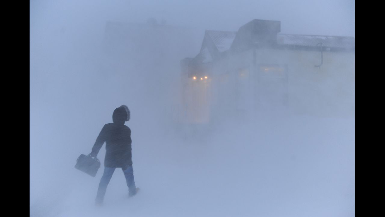 A man makes his way through a blizzard in Norilsk, Russia, on Tuesday, March 17.