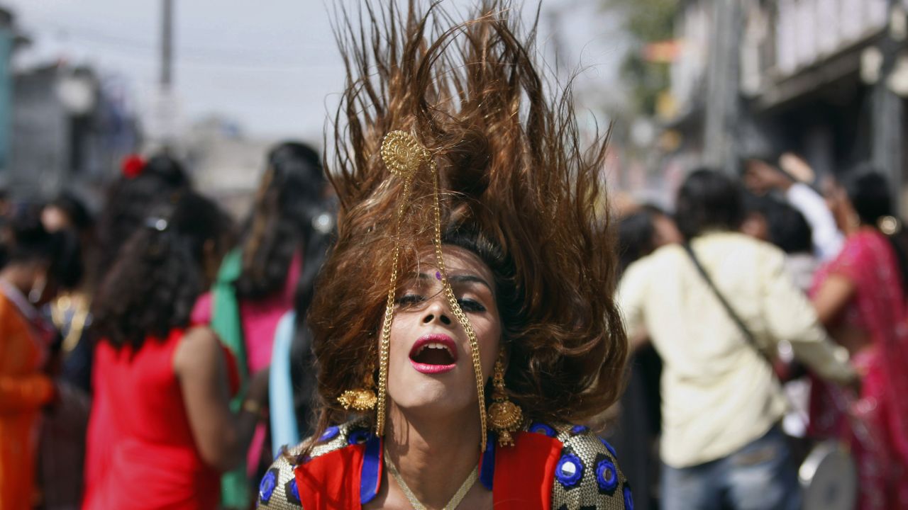 A eunuch dances in Jammu, India, on Friday, March 13, during a rally to mark the congregation of thousands of eunuchs from different parts of India. The term eunuch is used in India to describe transvestites, transsexuals and others who identify themselves as neither male nor female but as a member of a third gender.