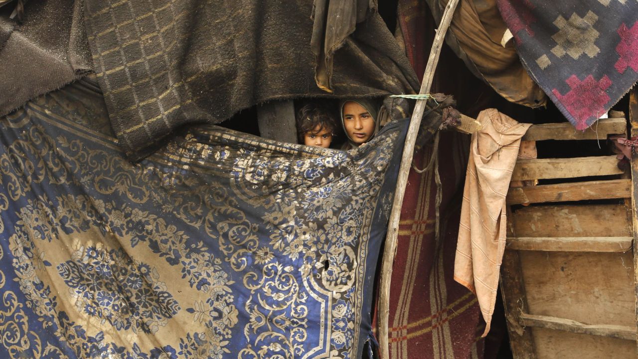 Young Kashmiri children look out from their temporary camp at Haal village, some 33 miles (53 kilometers) south of Srinagar, India, on Wednesday, March 18.