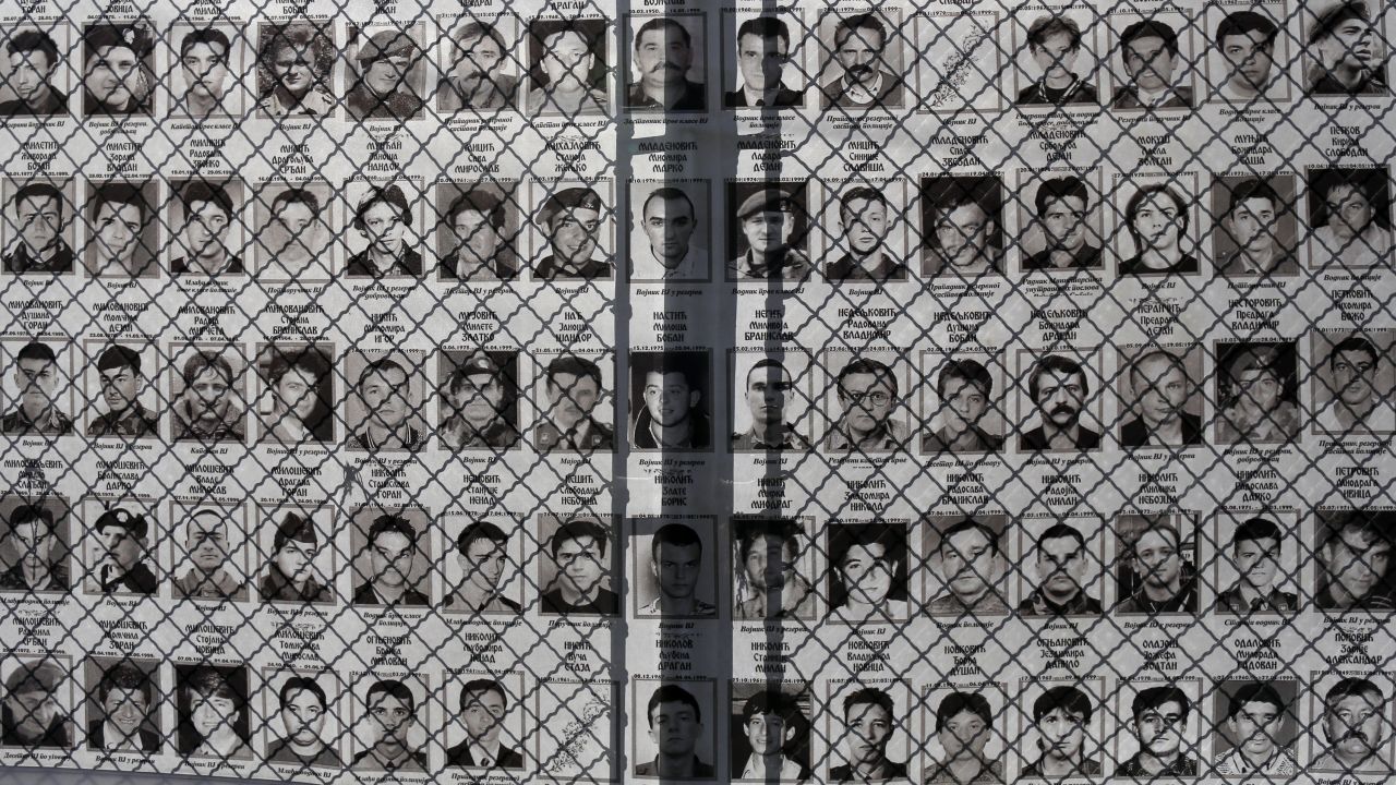 Photographs of Serbs missing and killed during the Kosovo War in 1998-99 are seen in front of Serbia's war crimes court in Belgrade, Serbia, on Tuesday, March 17.