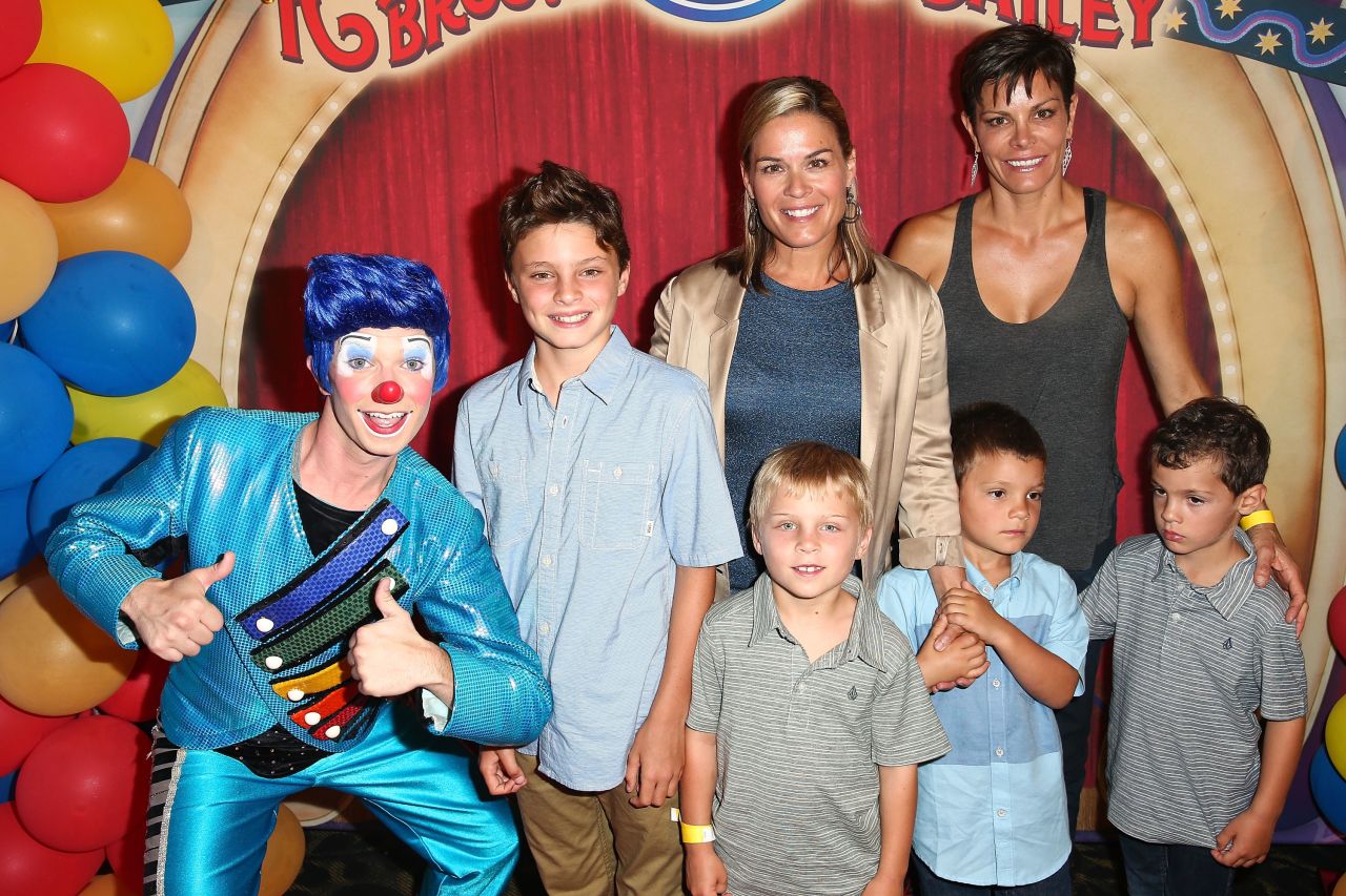 Celebrity chef Cat Cora, center, and wife Jennifer Cora are shown here with their four sons at the 2014 premiere of Ringling Bros. and Barnum & Bailey's "Legends" in Los Angeles.