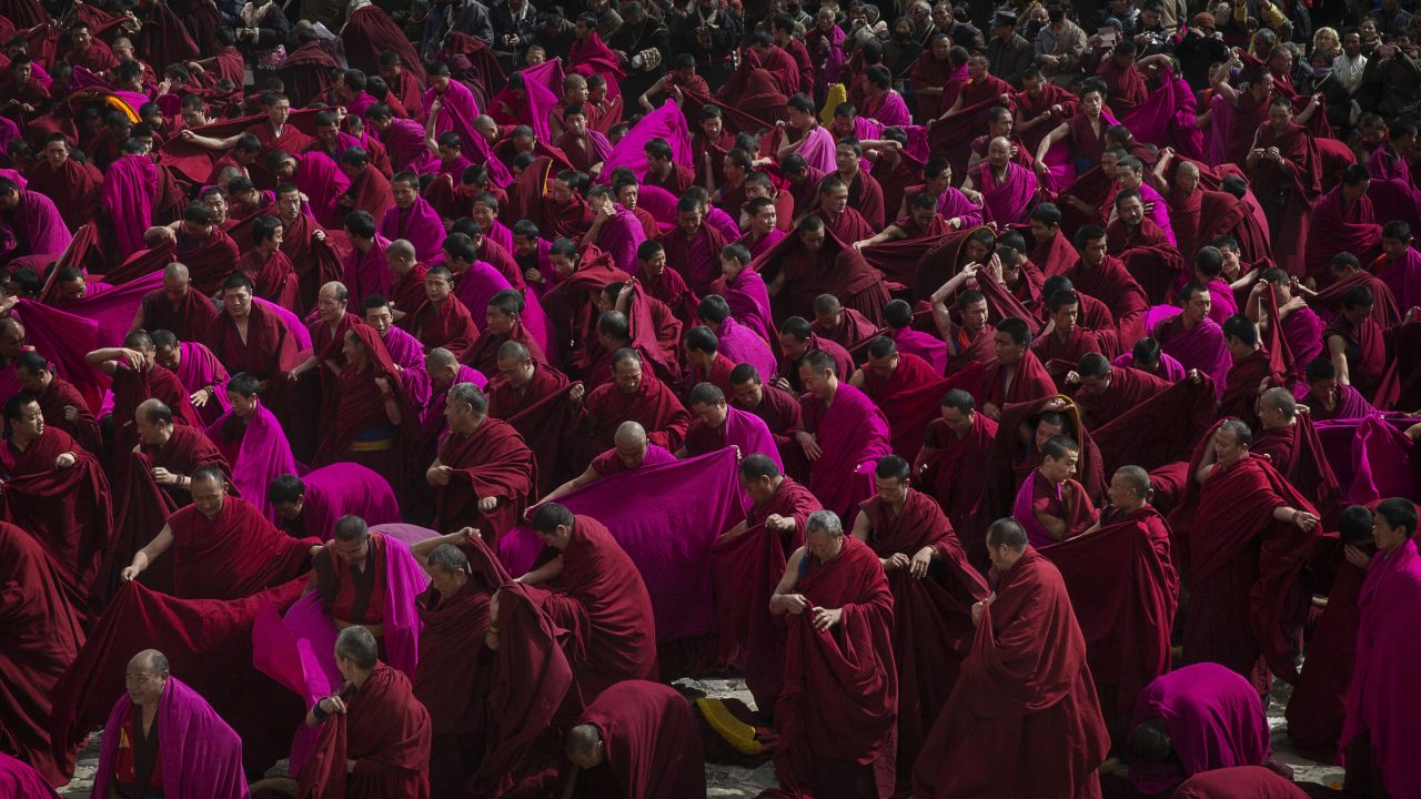 Monks unfurl their robes during "Great Prayer" rituals on March 5, 2015. Labrang Monastery is one of the six great monasteries of the Gelug school of Tibetan Buddhism and one of the largest outside of the Tibetan Autonomous Region. 