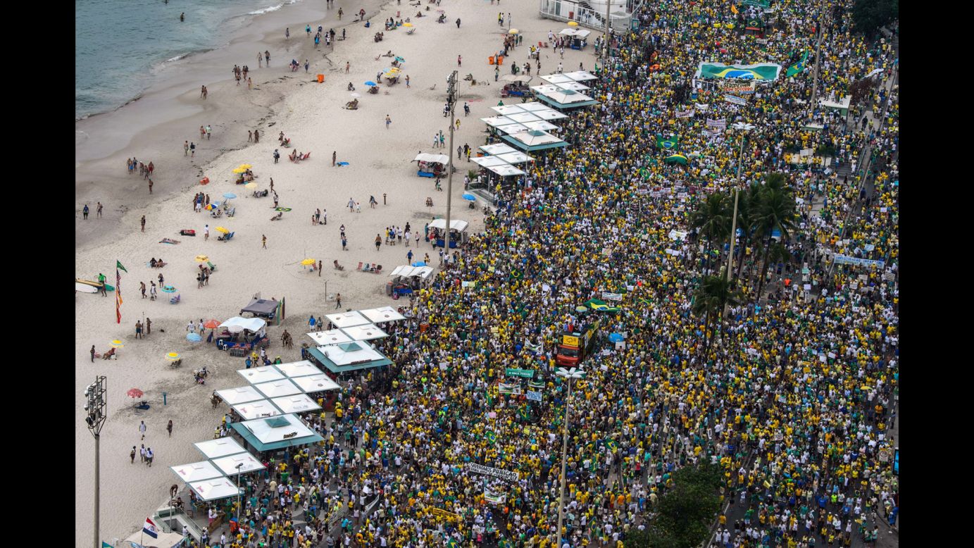 Demonstrators at Rio de Janeiro's Copacabana beach <a href="http://www.cnn.com/2015/03/15/americas/brazil-protests/index.html" target="_blank">protest against the government of Brazilian President Dilma Rousseff</a> on Sunday, March 15. Rousseff's administration is struggling amid a weak economy and a massive corruption scandal involving the country's state-run oil company.