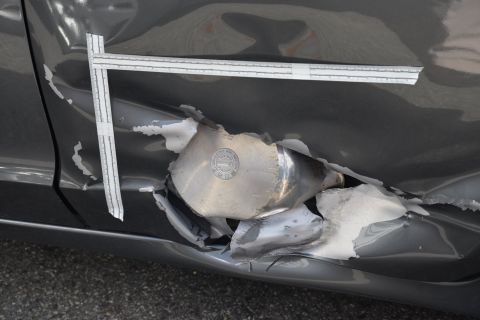 A pressure cooker was embedded in the side of a resident's Honda during the Watertown shootout.