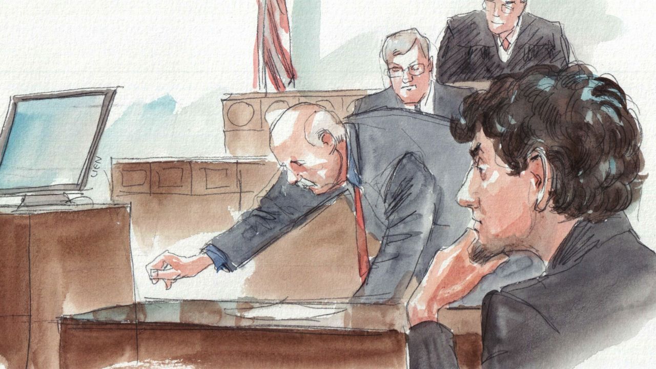 Police Sgt. Jeffrey Pugiliese shows how he tried to drag Tamerlan Tsarnaev out of the path of the Mercedes.