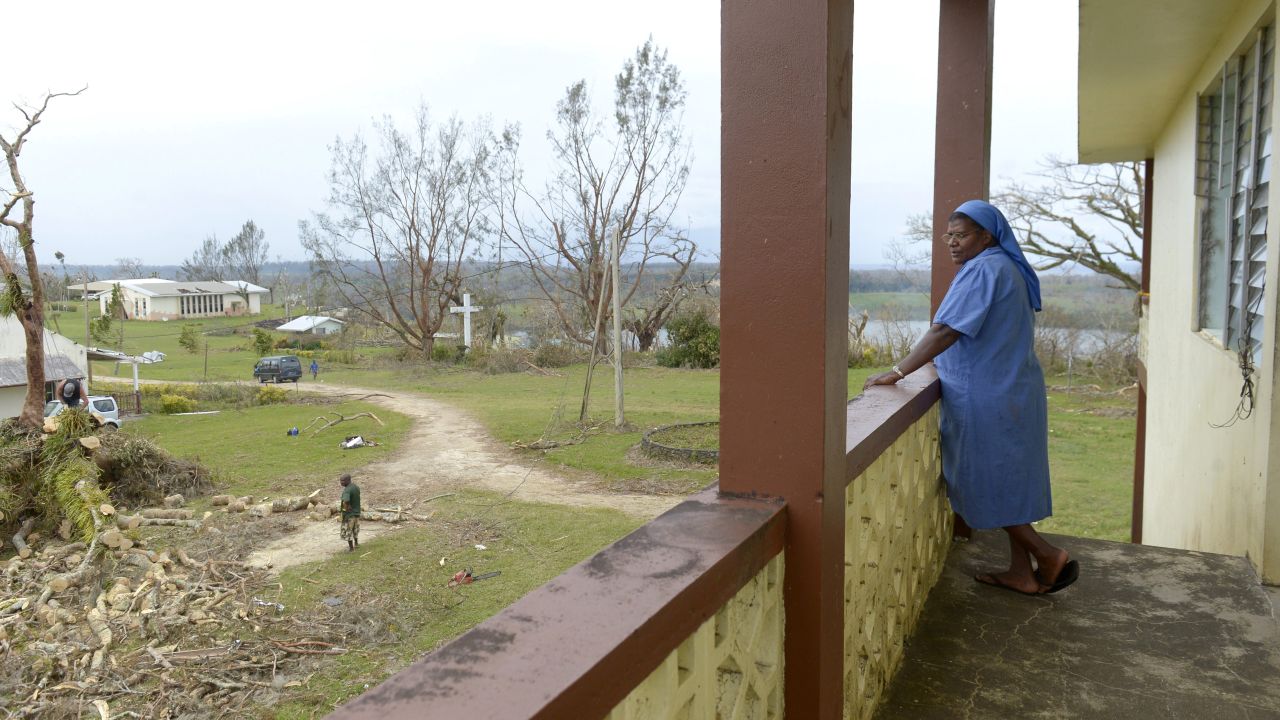 A nun surveys the damage near Port Vila on March 19.
