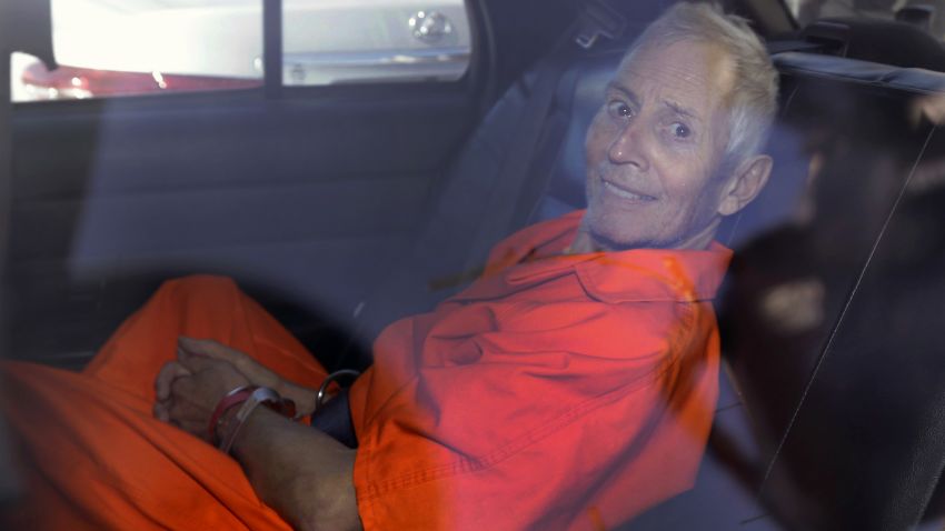 FILE - In this Tuesday, March 17, 2015, file photo, Robert Durst is transported from Orleans Parish Criminal District Court to the Orleans Parish Prison after his arraignment in New Orleans. The whispered words of Durst recorded in an unguarded moment in a bathroom could come back to haunt him - or help him - as he faces a murder charge. A possible move by prosecutors to introduce the incriminating material from a six-part documentary on his strange life and connection to three killings could back fire as interview footage did in the Michael Jackson molestation trial and the Robert Blake murder case.  (AP Photo/Gerald Herbert, File)