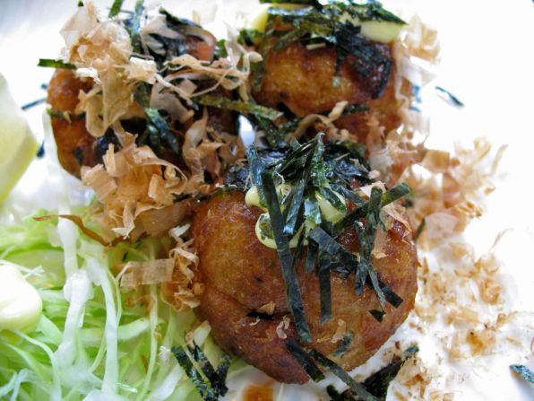 Made in baking trays, octopus balls contain ground shrimp, octopus cubes and octopus paste, topped with a floury coating, special teriyaki sauce and bonito flakes.