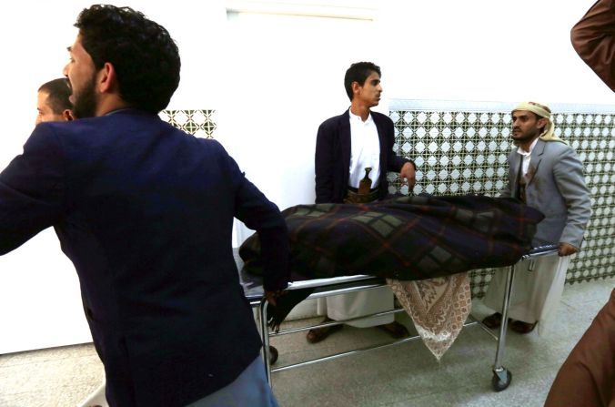 A casualty is wheeled to a hospital after the bombing attacks in Sanaa on March 20.