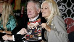Hefner and Madison sign copies of the November 2005 issue of Playboy in New York City.