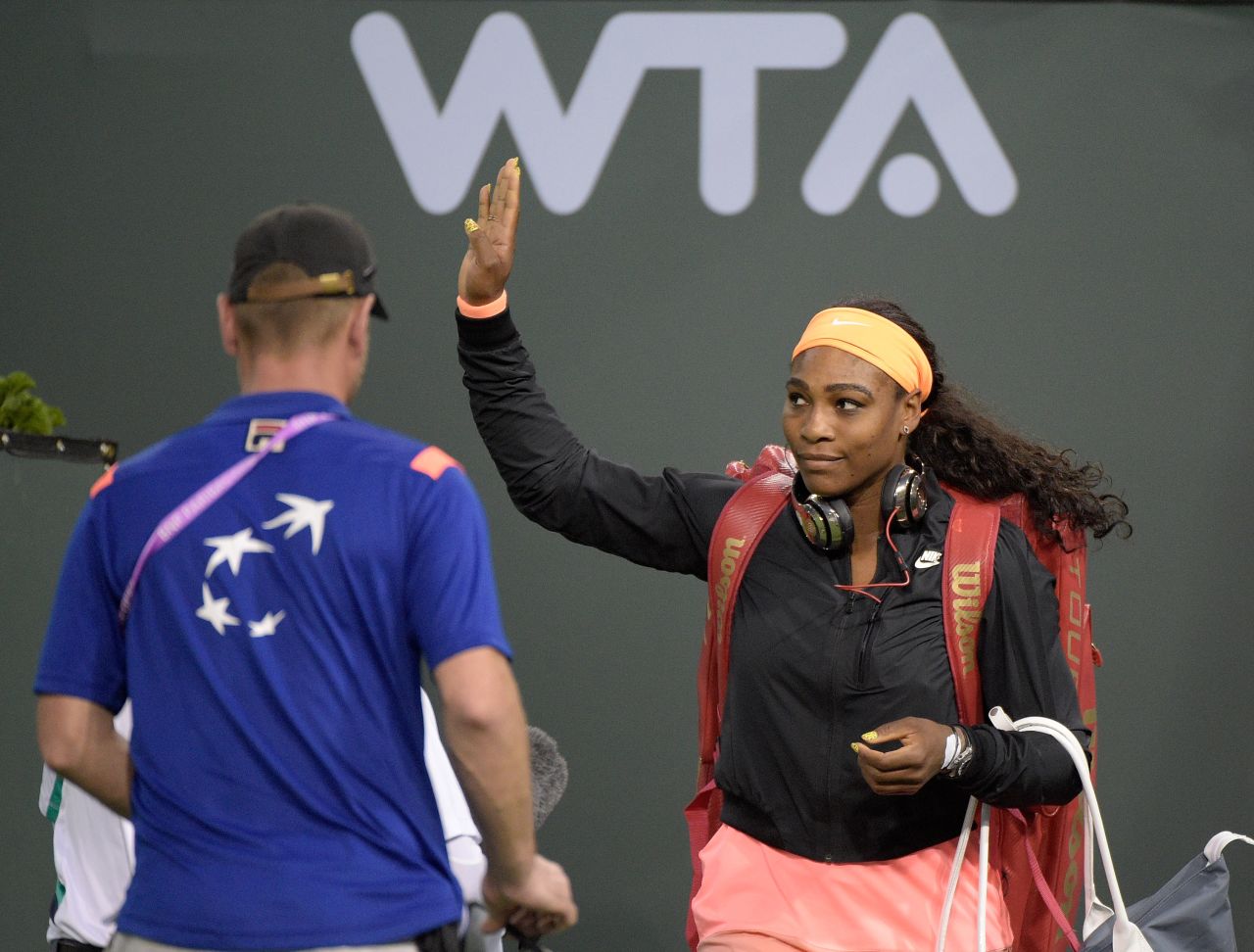Williams waves to the crowd as she enters stadium court before her match against Monica Niculescu of Romania at Indian Wells in 2015.