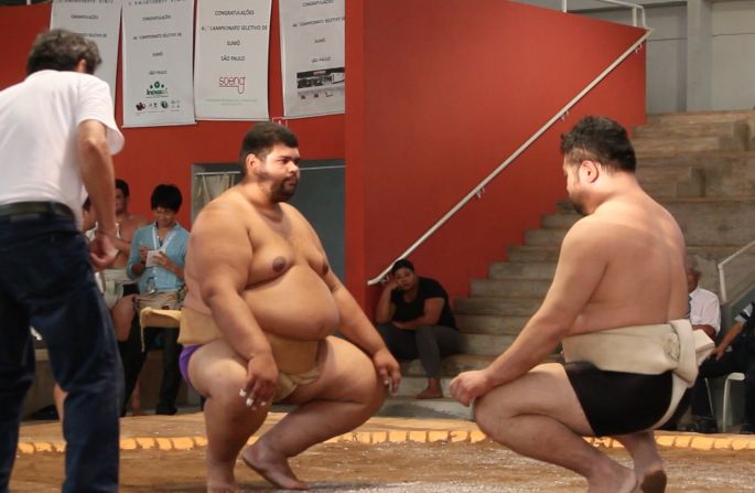 Women also compete in sumo, with Yoshi meeting his girlfriend of 10 years at the dohyō.