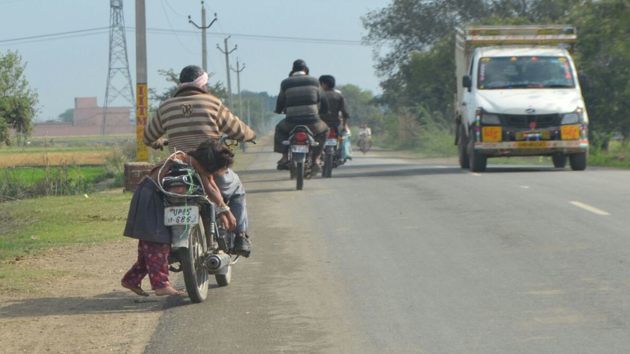 One father, desperate to get his daughter to sit her exams, lashed her to his motorbike to make sure she got to school.