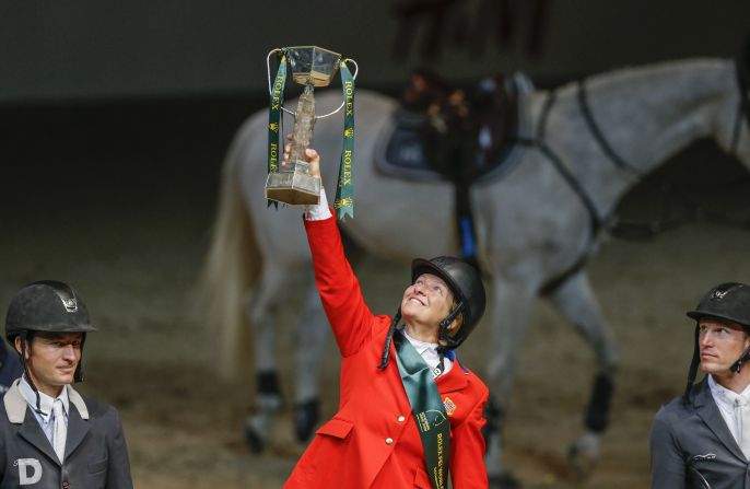 This is what showjumpers in the North American League hope to achieve -- Beezie Madden, of the U.S., lifts the overall World Cup jumping trophy in 2013.