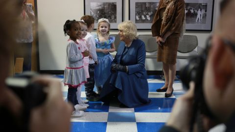 The duchess speaks with a group of children while visiting Neighborhood House, a community outreach center in Louisville's West End neighborhood, on March 20.