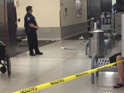 The machete allegedly used against TSA officers is seen on the floor of the airport.