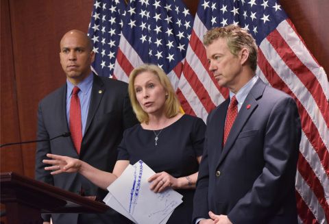 From left, U.S. Sens. Cory Booker, Kirsten Gillibrand and Paul attend a March 2014 news conference to announce a new medical marijuana bill at the U.S. Capitol in Washington.