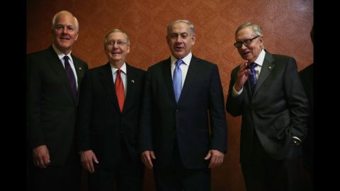 Senate Majority Whip John Cornyn, left, McConnell, Israeli Prime Minister Benjamin Netanyahu, and Senate Minority Leader Sen. Harry Reid, D-Nevada, pose for photos at the U.S. Capitol in Washington on March 3, the day of <a href="http://www.cnn.com/2015/03/02/politics/netanyahu-speech-iran-obama-congress/">Netanyahu's controversial speaking engagement</a> before a joint session of Congress.