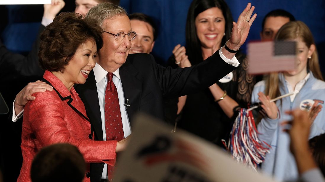 McConnell and Chao wave to supporters at a victory celebration following McConnell's victory in the Republican senatorial primary on May 20, 2014, in Louisville, Kentucky.
