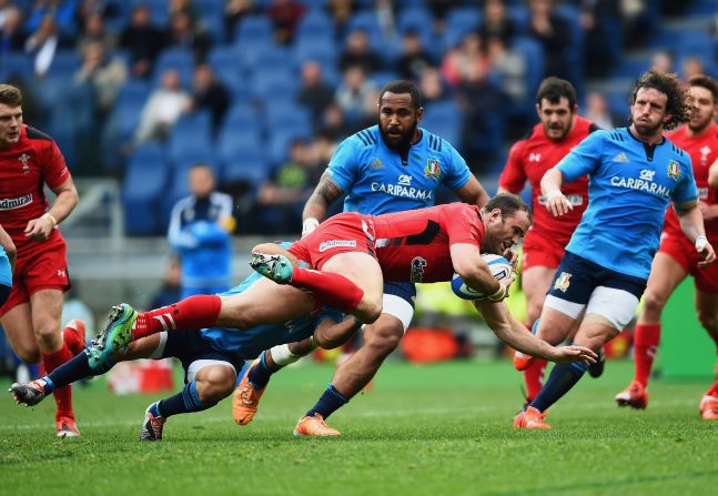 Wales struggled early on and although center Jamie Roberts (pictured with ball) crashed over for the games first try, the men in red went in trailing at halftime.