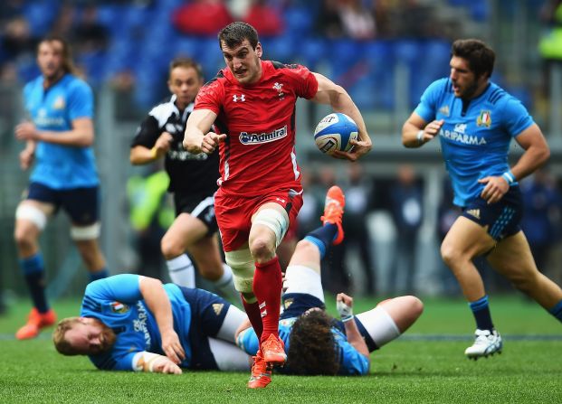 But an explosive start to the second period soon saw Wales surge ahead. Here, captain Sam Warbuton races through to score.