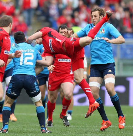 Liam Williams of Wales springs to catch a high kick during a closely fought first half in Rome.