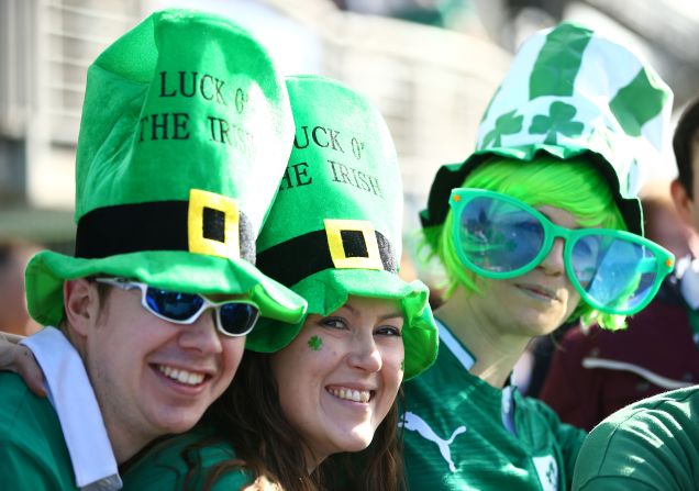 Ireland fans in upbeat mood, despite the huge Welsh victory earlier in the day, pose for the cameras before their side's Six Nations match with Scotland at Murrayfield Stadium in Edinburgh, Scotland.