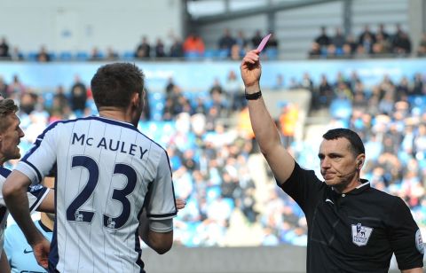 Referee Neil Swarbrick dismisses Gareth McAuley of West Bromwich Albion during Saturday's EPL match with Manchester City.