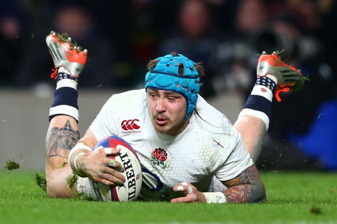 Jack Nowell of England dives over to score England's seventh try. With just six minutes remaining, England were 20 points ahead meaning one more converted try would give them the title.