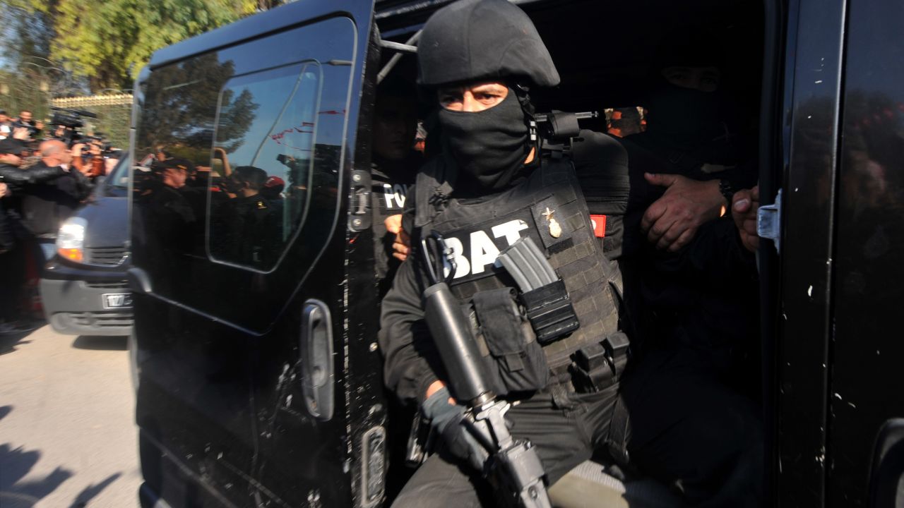 A member of the Tunisian special security forces sits in a car after the killing of two gunmen who attacked Tunis' famed Bardo Museum on March 18, 2015.