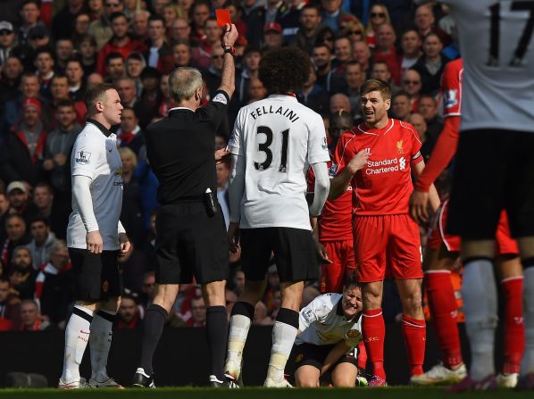 Steven Gerrard is shown a red card by referee Martin Atkinson for his stamp on Ander Herrera.  