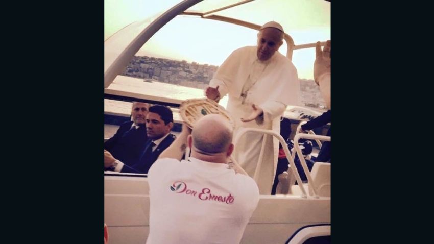 A pizzeria in Naples baked a special Papa Pizza for the Pope, and ran after his motorcade and handed it to him personally.