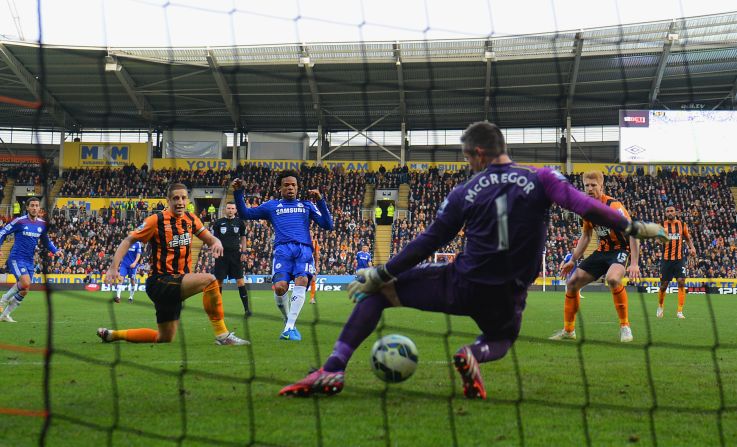 Loic Remy's shot squeezes under Allan McGregor to give table-topping Chelsea a 3-2 win at Hull.