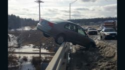 Colin Malone, 17, lost control of his car on Saturday, March 21, 2015, in Nashua, New Hampshire, struck a snow mound and was "pitched in the air before coming to rest on the railing of the Sagamore Bridge above the Merrimack River," according to a statement on the New Hampshire Trooper's Association's Facebook page. 