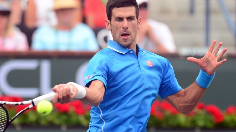 Novak Djokovic powers a shot during his victory over Roger Federer in the Indian Wells final.  