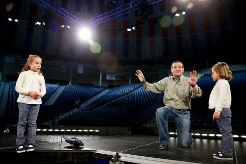 Cruz brings his daughters Caroline, left, and Catherine on stage during a walk-through Sunday, March 22, at Liberty University in Lynchburg, Virginia.