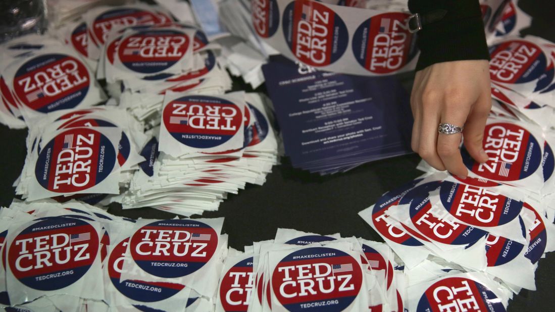 A woman piles up Cruz stickers during the Conservative Political Action Conference.