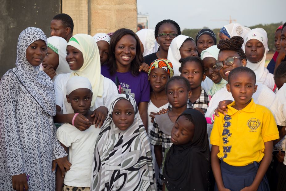 Tech entrepreneur and mentor Regina Agyare, center, pictured  with some of her students in Nima. 