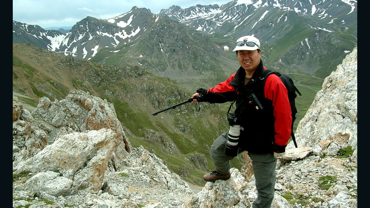 Scientist Li Weidong points to where he and his team spotted the Ili pika in July 2014. 