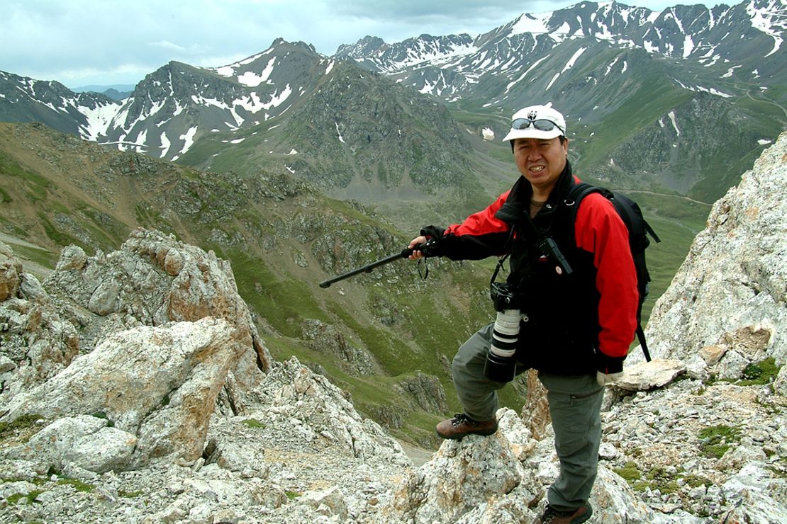 Scientist Li Weidong points to where he and his team spotted the Ili pika in July 2014. 