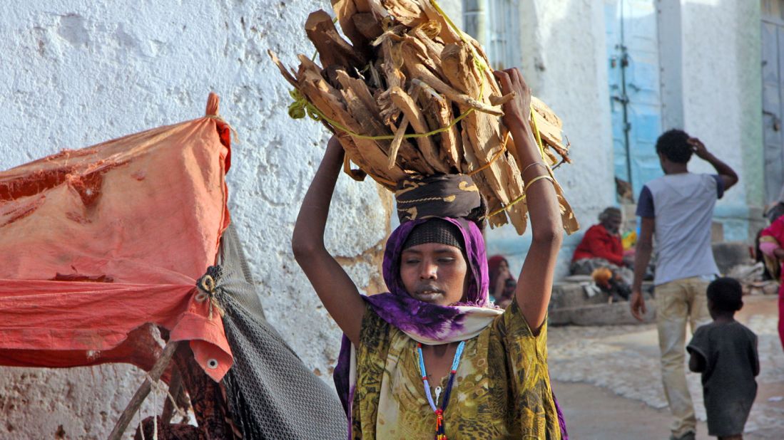 Bundles of firewood are still transported by hand ... and head. 