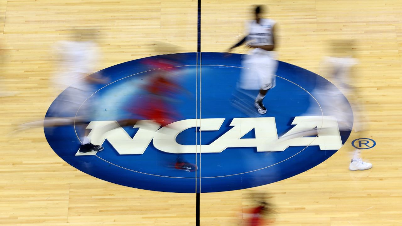 JACKSONVILLE, FL - MARCH 19:  Mississippi Rebels and Xavier Musketeers players run by the logo at mid-court during the second round of the 2015 NCAA Men's Basketball Tournament at Jacksonville Veterans Memorial Arena on March 19, 2015 in Jacksonville, Florida.  (Photo by Mike Ehrmann/Getty Images)