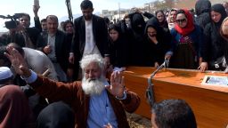 Independent Afghan civil society activist women and Afghan men lower the coffin of Afghan woman Farkhunda, 27, who was lynched by an angry mob, at the cemetary in central Kabul on March 22, 2015.  Hundreds of people on March 22, attended the burial of an Afghan woman who was beaten to death and set on fire by a mob for allegedly burning a copy of the Koran.  The body of Farkhunda, 27, who was lynched on March 19 by an angry mob in central Kabul, was carried to the graveyard by women amid crowds of men, an AFP reporter said, a rare act of protest in a male-dominated society.   AFP PHOTO / Wakil Kohsar        (Photo credit should read WAKIL KOHSAR/AFP/Getty Images)