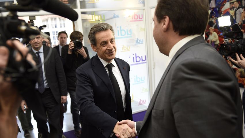 President of the center-right party UDI Jean-Christophe Lagarde (R) shakes hands with UMP right-wing party president Nicolas Sarkozy (C) before a meeting at the UDI headquarters in Paris on March 23, 2015. The French right was celebrating today after local elections saw a conservative alliance and the far-right National Front triumph over the ruling Socialists in a key test ahead of the 2017 presidential poll. An alliance led by Sarkozy took first place in Sunday's first-round polling with 29.4 percent of the vote, while the National Front (FN) of Marine Le Pen came second with 25.2 percent, according to latest figures from the interior ministry. AFP PHOTO / MARTIN BUREAUMARTIN BUREAU/AFP/Getty Images