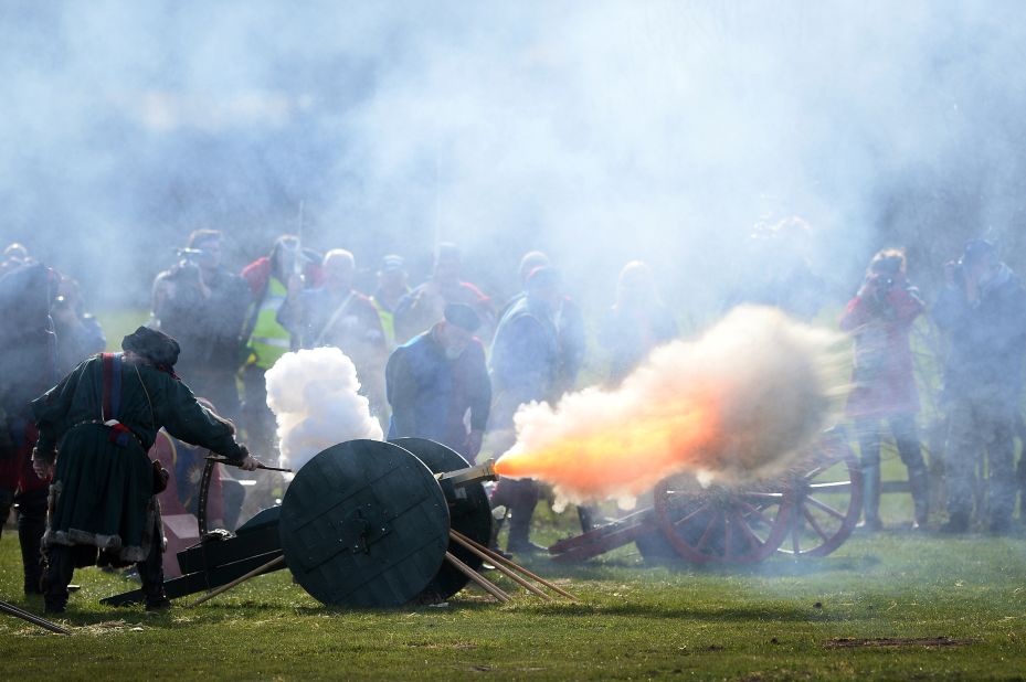 Members of a re-enactment group perform a 21-gun salute on March 22, during a ceremony for Richard III at the Bosworth Battlefield Heritage Center in Nuneaton, England.
