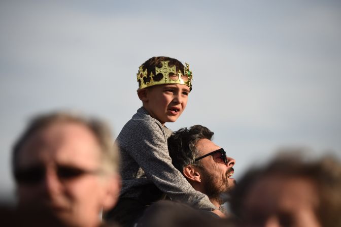 Spectators await the ceremonial procession on March 22.